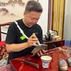 老魏玩石头像